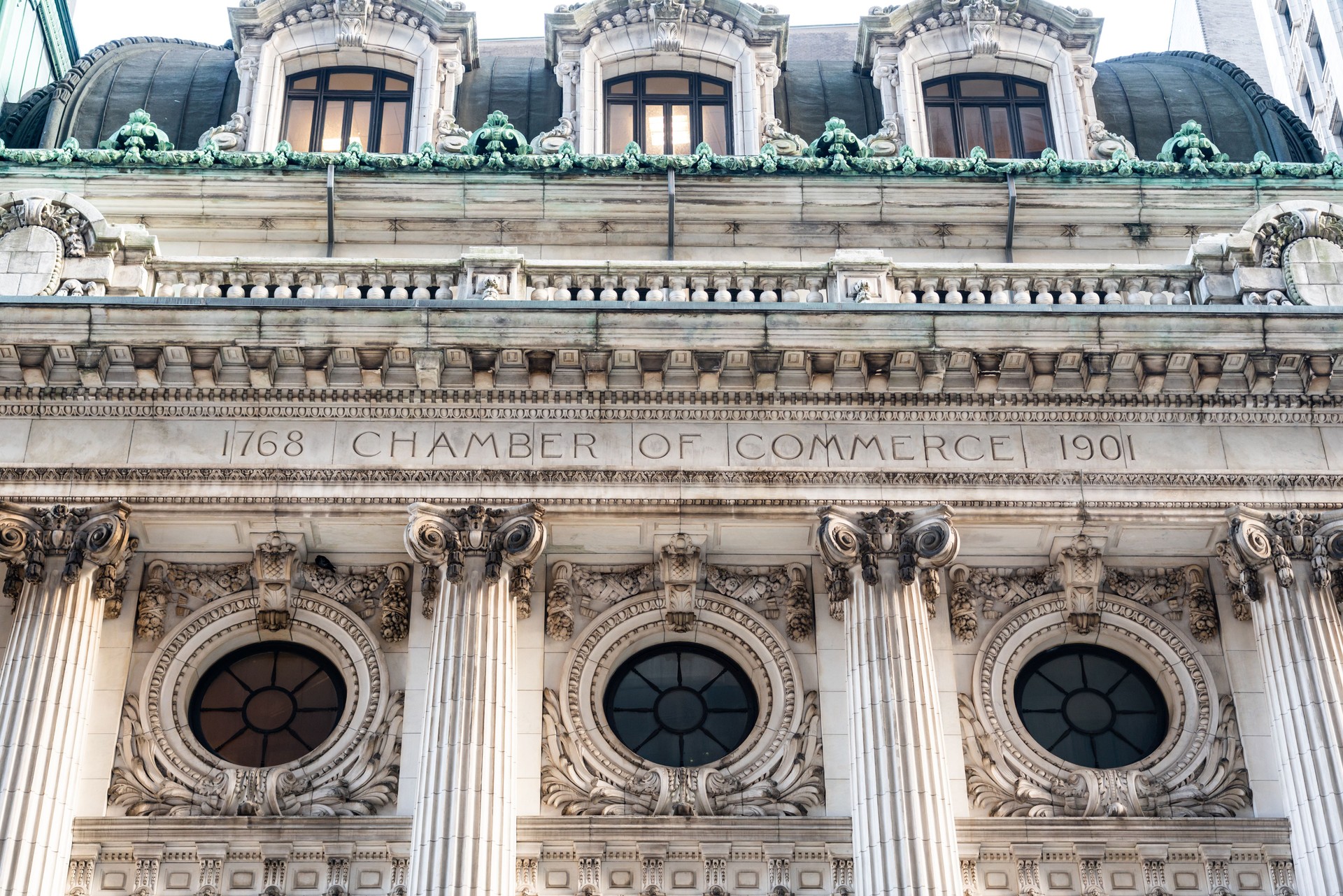 Columns of the facade of the chamber of commerce building in the financial district of Manhattan